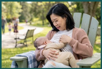 A woman breastfeeding a baby